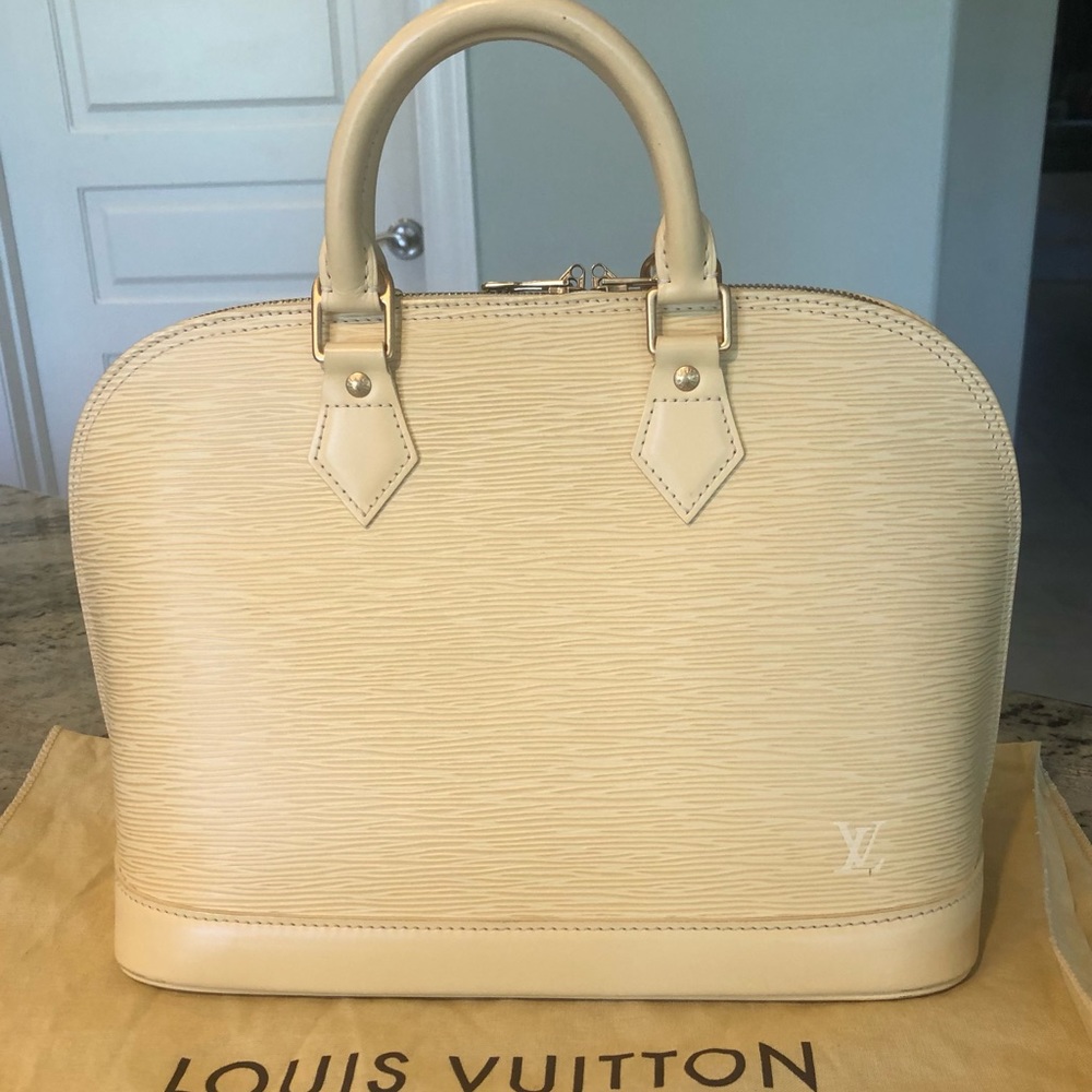 Authentic Louis Vuitton Creme Alma Leather Handbag